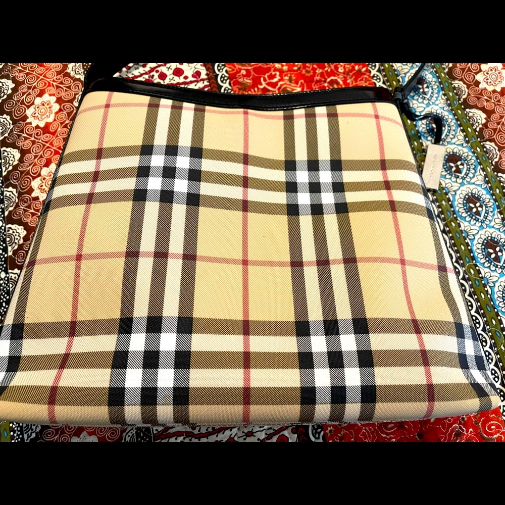 Authentic Burberry shoulder bag with dust cover.